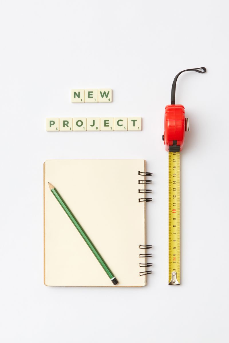 Notebook and measuring tape on desk — planning