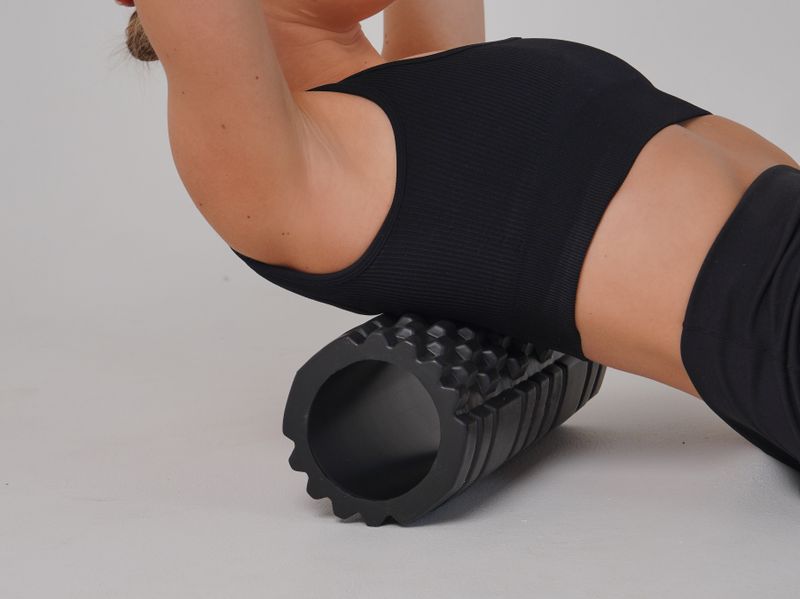Person using foam roller for recovery